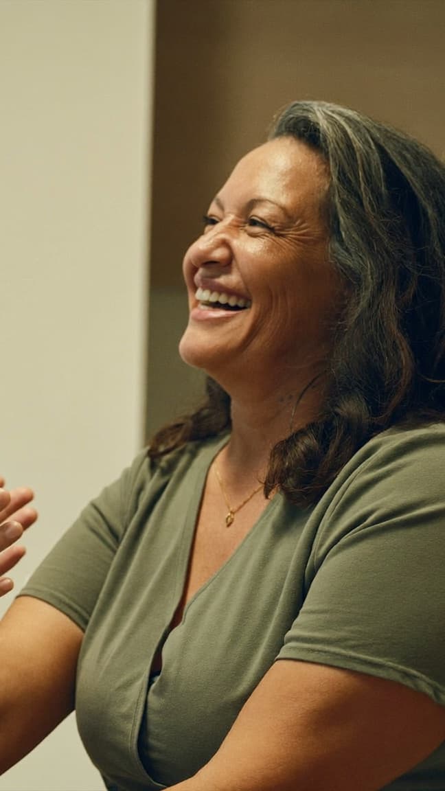 A NoMi Beach Health patient laughing during an unhurried consultation